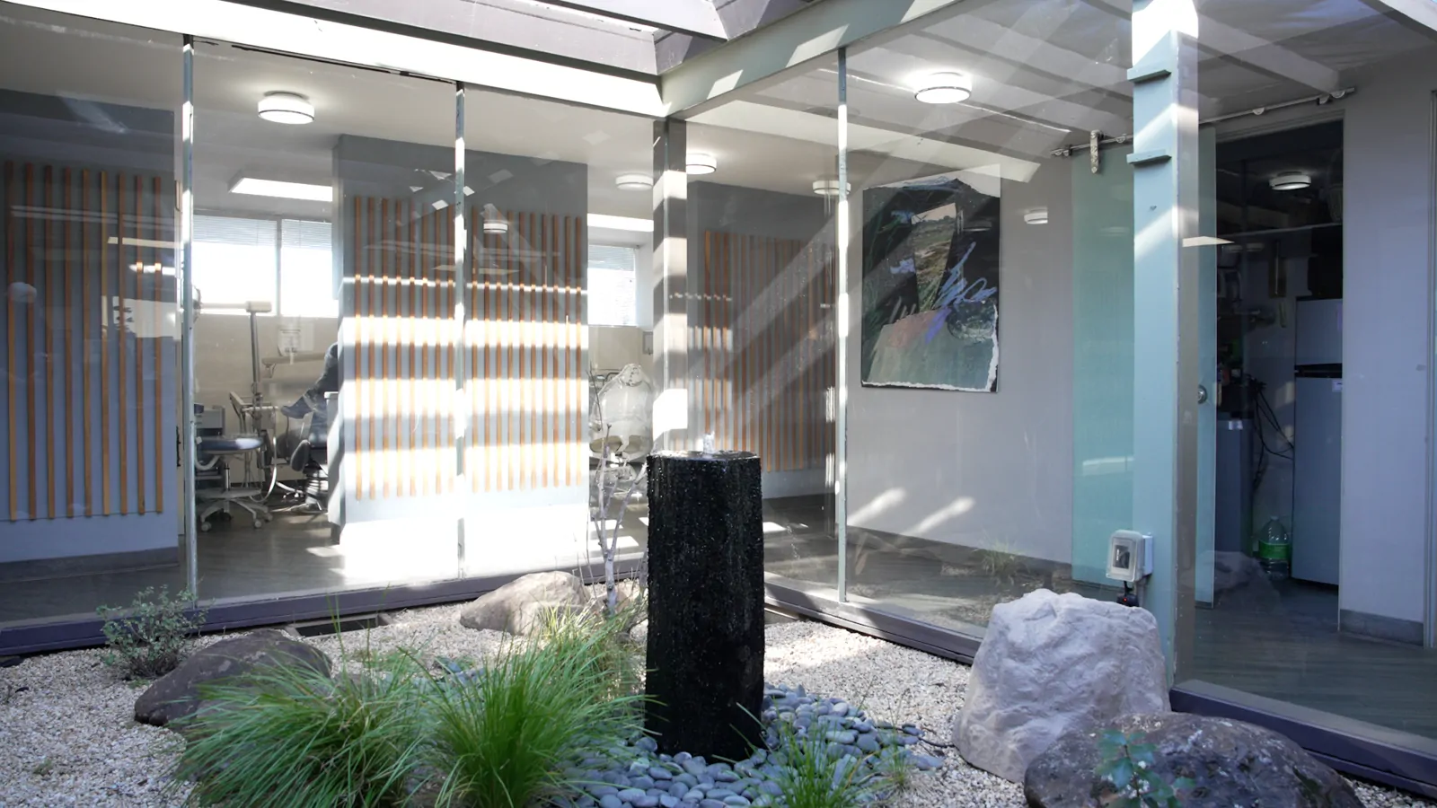 The garden courtyard with a water feature at the Palo Alto dental office
